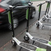 Electric scooters on a street side.