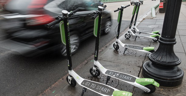 Electric scooters on a street side.