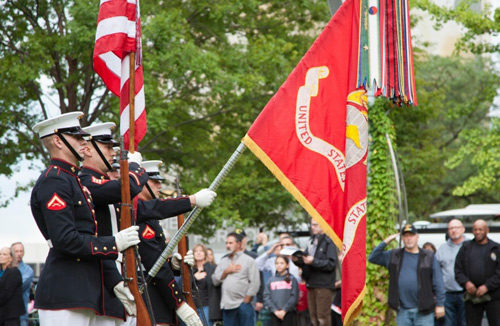 Marine Color Gaurd march with the U.S. and Marines flags.