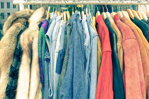 Collection of coats on a rack.