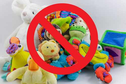 A collection of stuffed animals with a no symbol superimposed over them.