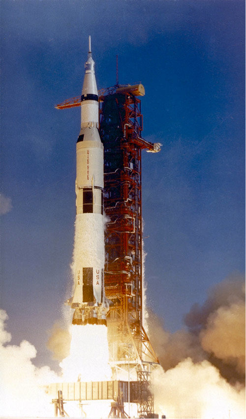 The Apollo 11 rocket launching off its launch pad.