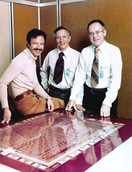 Intel men with a giant chip board