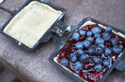 Blueberry pie in cast iron pots