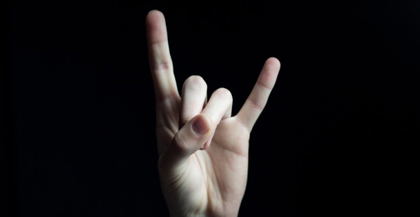 Hand in the "devil-horns" sign