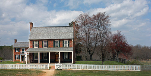 A farmhouse during a sunny day.