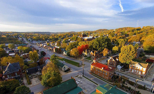 Photo of Harmann, Missouri. Shows streets, homes, and trees