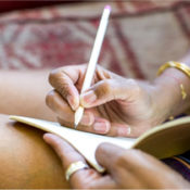Woman writing in her journal