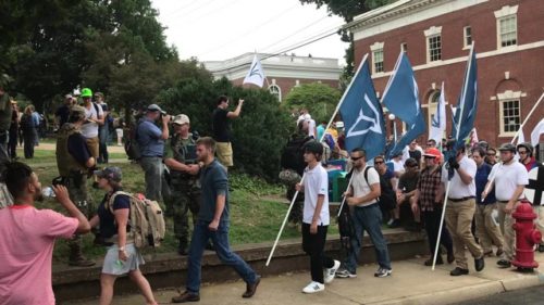 White supremacists march with flags during the "United the Right rally in Charlottesville.