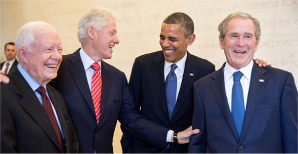 Presidents Jimmy Carter, Bill Clinton, Barack Obama, and George W. Bush share a moment.