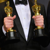 Oscar winners holding their statuettes