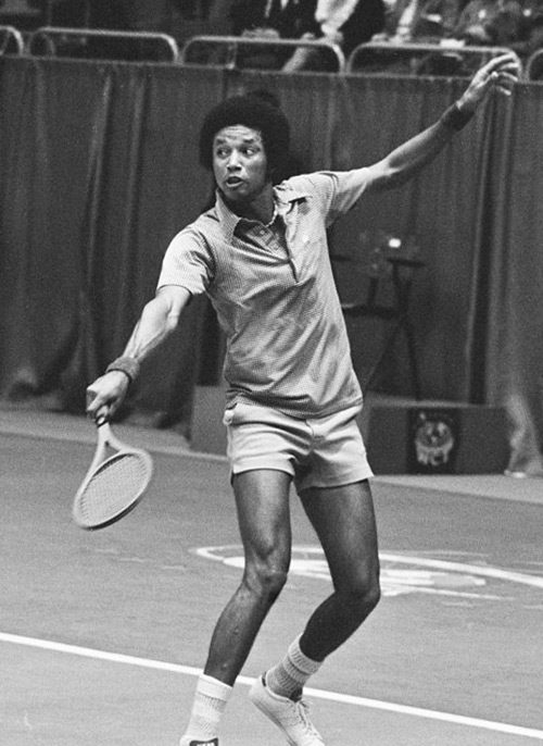Arthur Ash playing tennis.