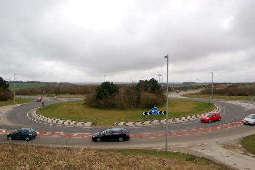 Cars driving around a roundabout