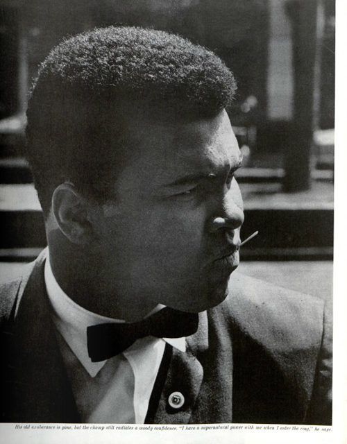 Muhammad Ali wearing a suit