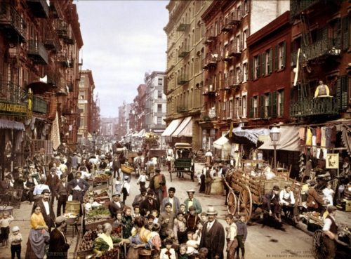 Mulberry Street with horse drawn carriage and citizens posing for the camera