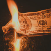 A $100 dollar bill on fire.
