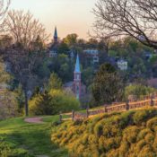View of Galena, Illinois. Homes, churches, and lush trees can be seen.