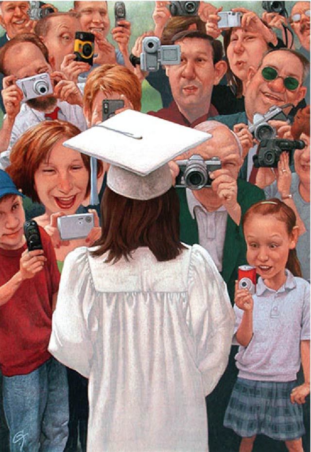 Young college graduate in cap and gown having her photo taken by a crowd