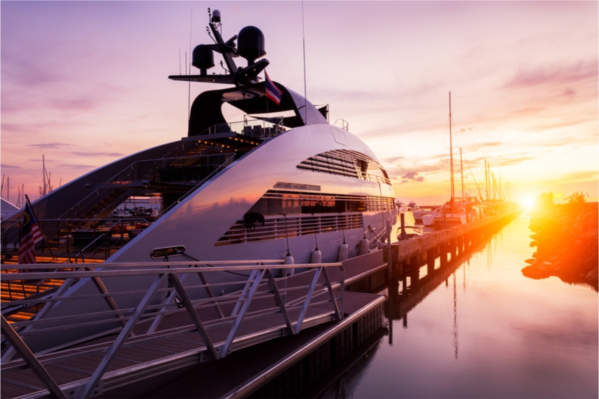 Expenive yacht in port at sunset.
