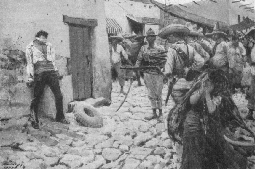 A prisoner lays against a wall as Mexican soldiers point their guns towards him