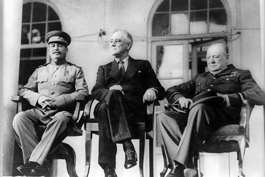 Joseph Stalin, Franklin Delano Roosevelt, and Winston Churchil sit together during the 1943 Tehran Conference