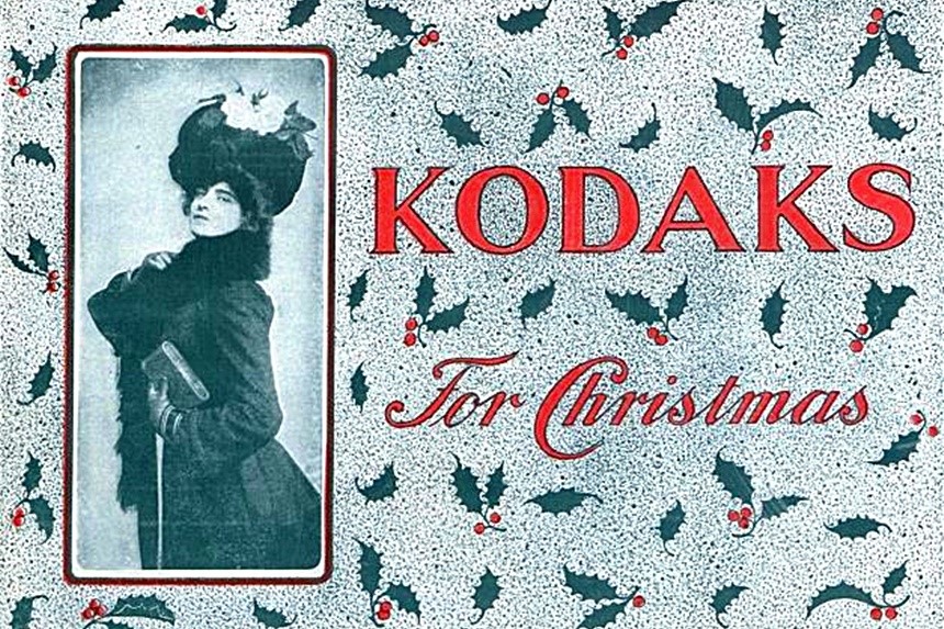 Kodak advertisement featuring a woman in a winter coat and hat
