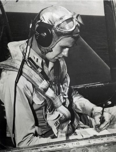 A young George H.W. Bush in the pilot's seat of his plane