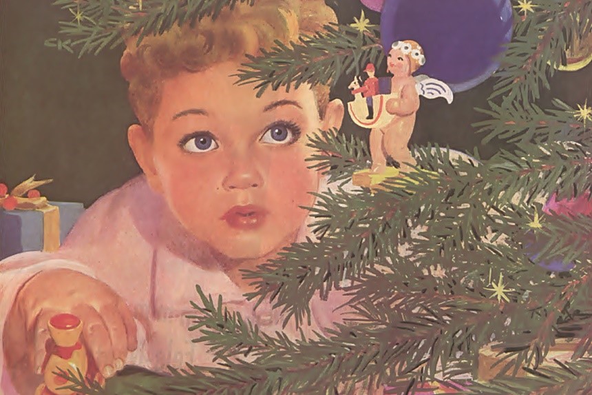 Child looks at angel ornament in a Christmas tree