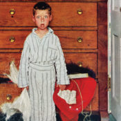 A shocked little boy finding his parent's Santa Claus outfit in their dresser.
