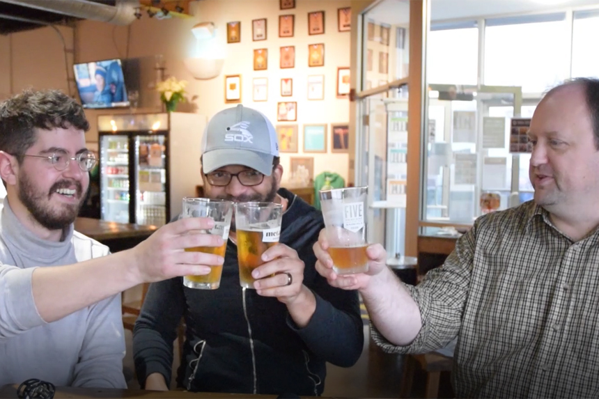 Nick Gilmore, Chris Wakefield, and Troy Brownfield chat about the week's topics at a cafe.