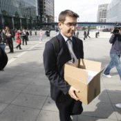 A terminated Lehman Brothers employee in London carries his belongings following the company's bankruptcy in September, 2008.
