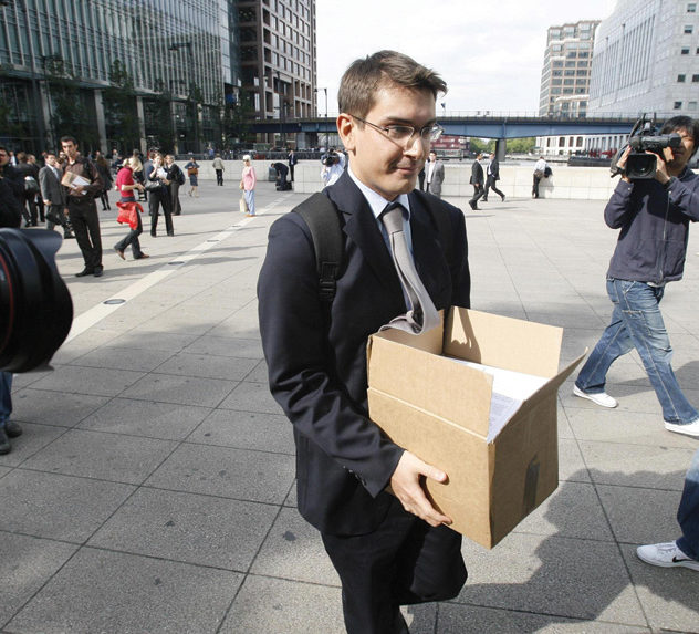 A terminated Lehman Brothers employee in London carries his belongings following the company's bankruptcy in September, 2008.