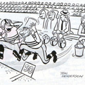 Two football players rush from the sidelines as one pours a bucket of water over his head.