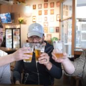 Saturday Evening Post staff members Nick Gilmore, Chris Wakefield, and Troy Brownfield having a chat in a bar about what happened during the past week at the Saturday Evening Post