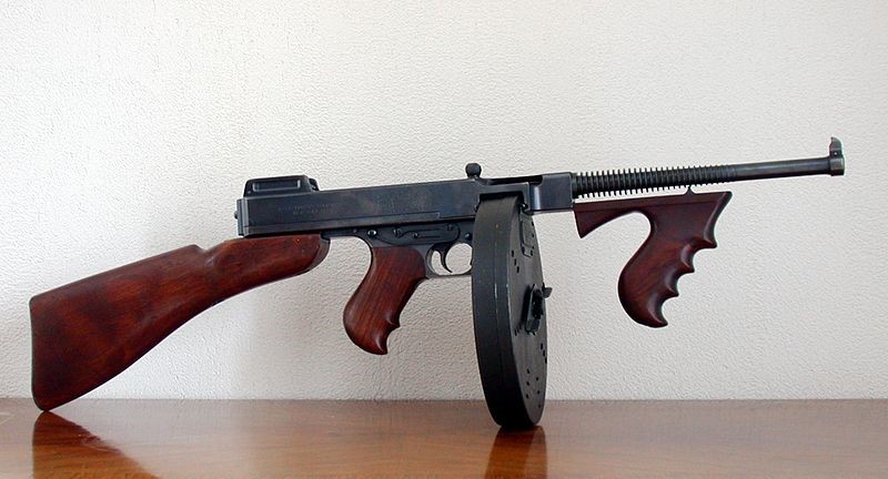 A machine gun on a table.