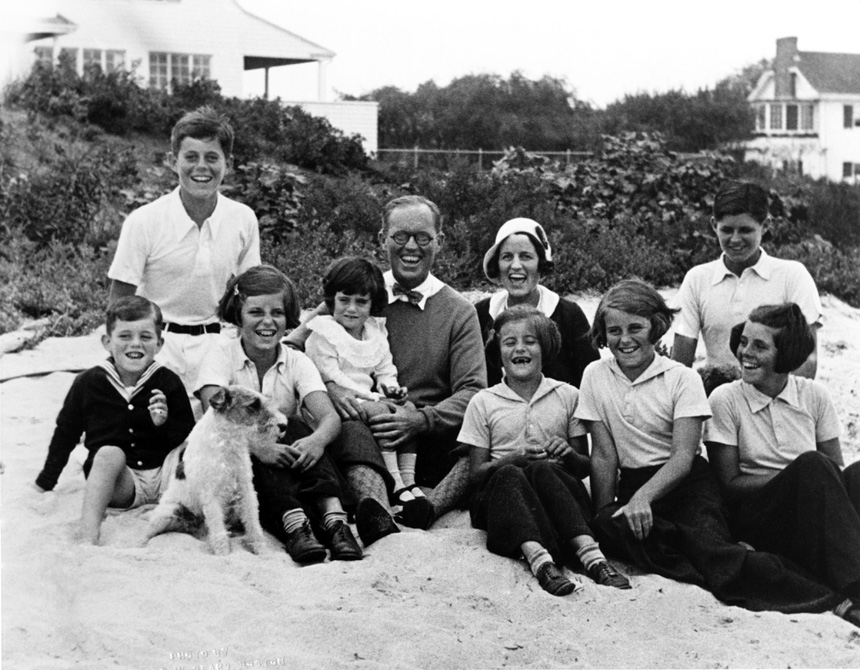 The Kennedy family pose for a photo on a sandy shore