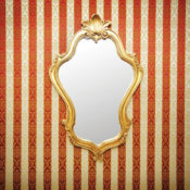An elegant, gold-trimmed mirror on a wall.