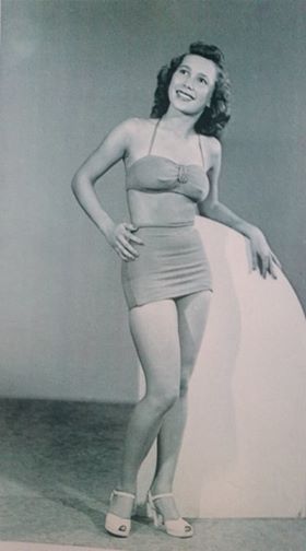 Picture of Joy Haubner in a bathing suit when she was younger