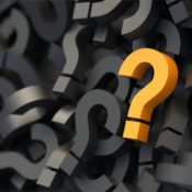 An orange question mark atop a pile of grey ones