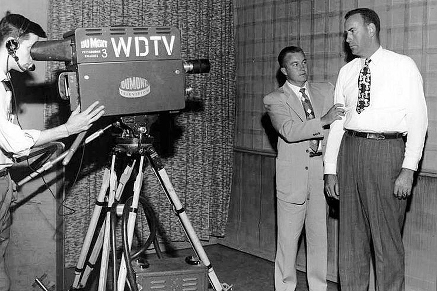 An interview occurs on set for the DuMont television network.