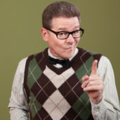 A geek in a sweater and glasses shares knowledge