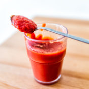 A glass of strawberry marinade