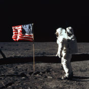 Astronaut Buzz Aldrin poses in front of the U.S. flag on the moon during the Apollo 11 moon landing.