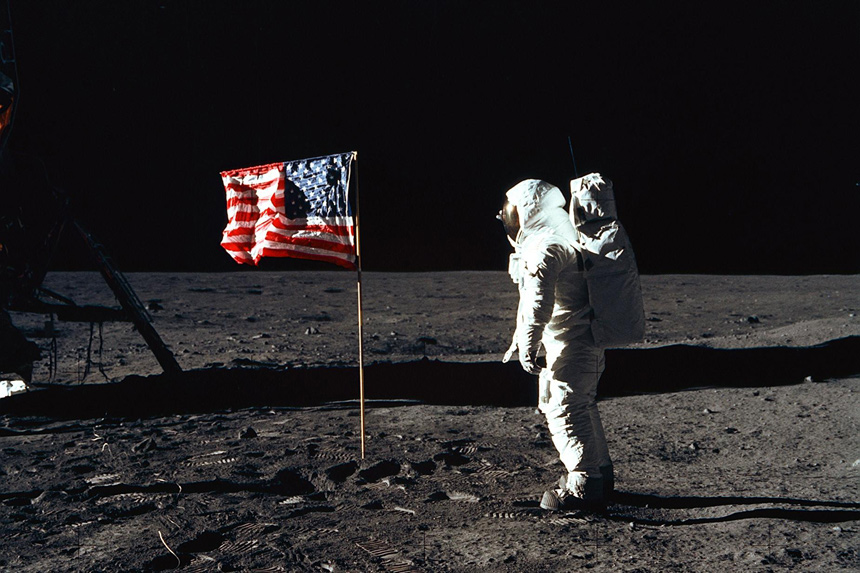 Astronaut Buzz Aldrin poses in front of the U.S. flag on the moon during the Apollo 11 moon landing.