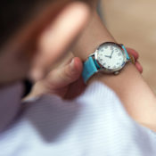 Boy looking at his wristwatch