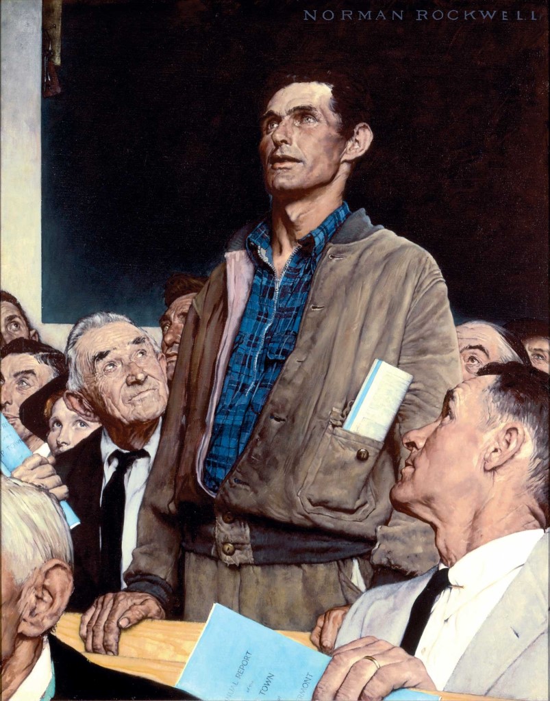 Man standing up to speak during a meeting