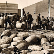 Prohibition agents seizing barrels of liquor