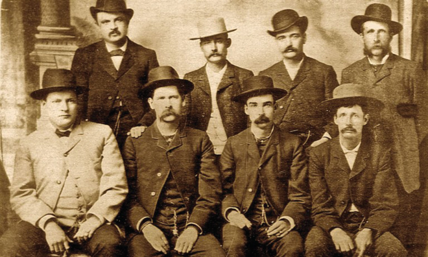 Members of the Dodge City Peace Commission, seated for a photo. Wyatt Earp and Bat Masterson are included.