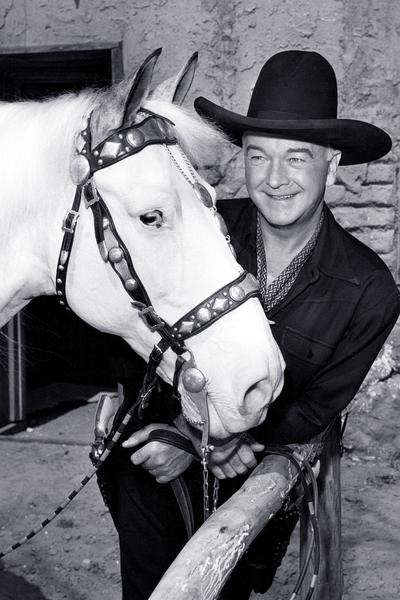 The classic western character Hopalong Cassidy with his horse.