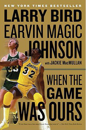 The cover for the book, "When the Game Was Ours," by Larry Bird and Magic Johnson, and collaborated with Jackie MacMullan. The cover features Bird and Johnson in their respective uniforms.